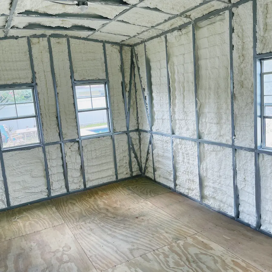 Closed-cell spray foam insulation applied to wall cavities in a residential project in Elmwood